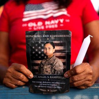 People attend a vigil for fallen U.S. soldier Sgt. Rampersad in the Queens Borough of New York City