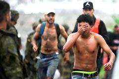 Migrants from Morocco arrive at the Spanish border in Ceuta