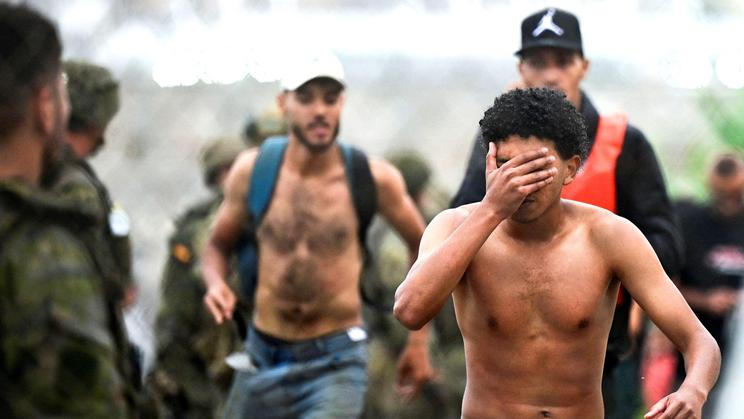 Migrants from Morocco arrive at the Spanish border in Ceuta