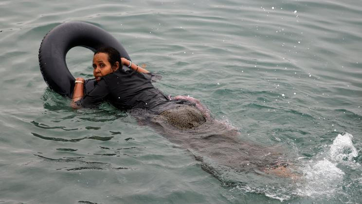 Migrants cross into the Spanish enclave of Ceuta