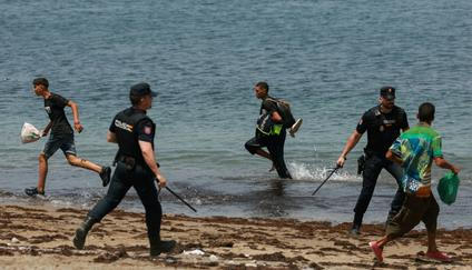 Mass crossings of migrants on foot and by sea from Morocco into Spanish territory, in Ceuta