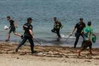 Mass crossings of migrants on foot and by sea from Morocco into Spanish territory, in Ceuta