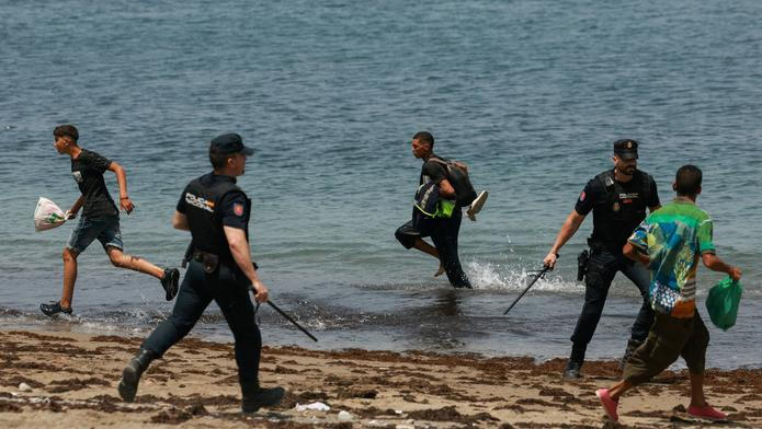 Mass crossings of migrants on foot and by sea from Morocco into Spanish territory, in Ceuta
