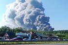 Smoke rises after a Ukrainian drone attack on a Wildberries warehouse, in Novosemeykino