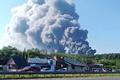 Smoke rises after a Ukrainian drone attack on a Wildberries warehouse, in Novosemeykino