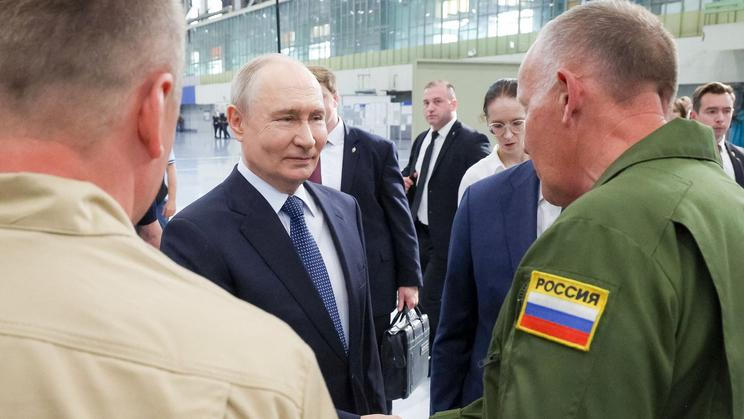 Russian President Vladimir Putin visits an aviation plant in Irkutsk
