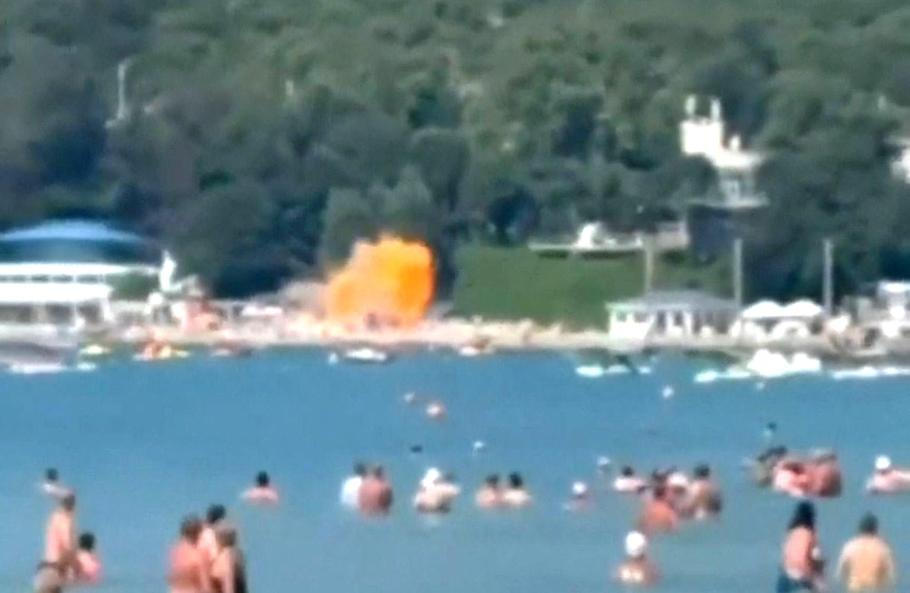 A screengrab from a video obtained from social media shows the moment of a drone strike on a beach, at the holiday village of Arkhipo-Osipovka, Gelendzhik resort area