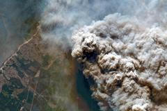 Smoke rises from a wildfire in Andernos-les-Bains