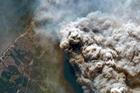 Smoke rises from a wildfire in Andernos-les-Bains