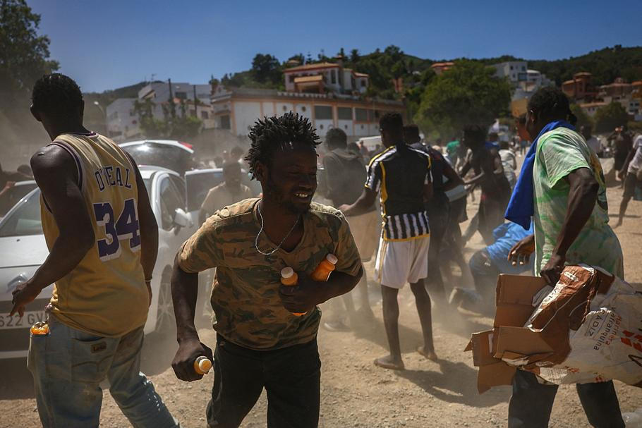 Mass crossings of migrants on foot and by sea from Morocco into Spanish territory, in Ceuta