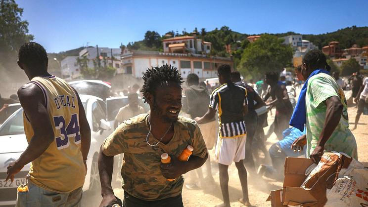 Mass crossings of migrants on foot and by sea from Morocco into Spanish territory, in Ceuta