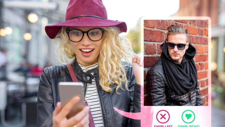 Young,Woman,Using,Dating,App,On,Mobile,Phone