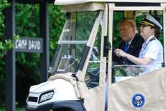 U.S. President Trump participates in a cabinet meeting at Camp David in Thurmont, Maryland