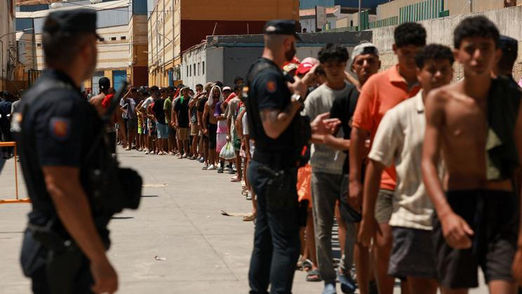 Mass crossings of migrants on foot and by sea from Morocco into Spanish territory, in Ceuta