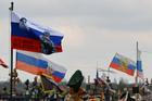 Flags fly over the graves of Russian service members in Donetsk