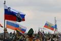 Flags fly over the graves of Russian service members in Donetsk