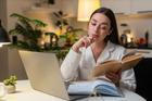 Young,Woman,At,Night,Home,Studies,On,Laptop,Watches,Tutorial