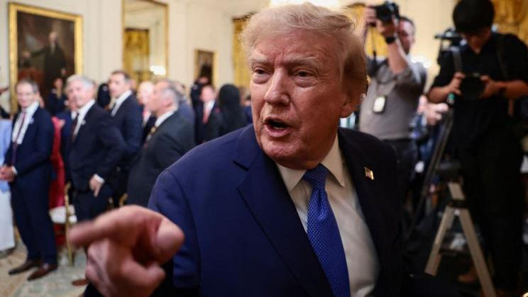 U.S. President Donald Trump participates in a Team USA reception in the East Room at the White House
