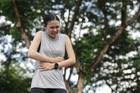 Women,Experiencing,Severe,Abdominal,Pain,Outdoors,,Possibly,Due,To,Stomach