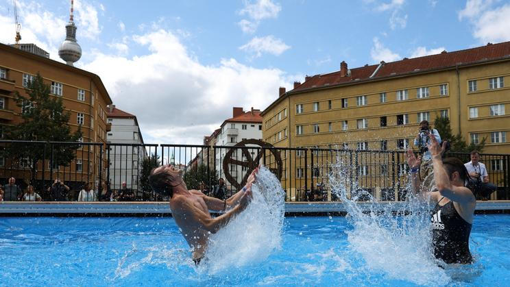 Berlin's Volksbuehne theatre install a temporary public swimming pool outside its building at Rosa-Luxemburg-Platz