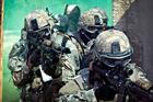 U.S. Army paratroopers assigned to the 1st Battalion, 508th Parachute Infantry Regiment, 82nd Airborne Division prepare to enter a building as they conduct close-quarters combat training during an air assault mission September 26, 2013 at Fort Bragg, NC.