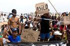 Migrants seek asylum in Ceuta after crossing from Morocco