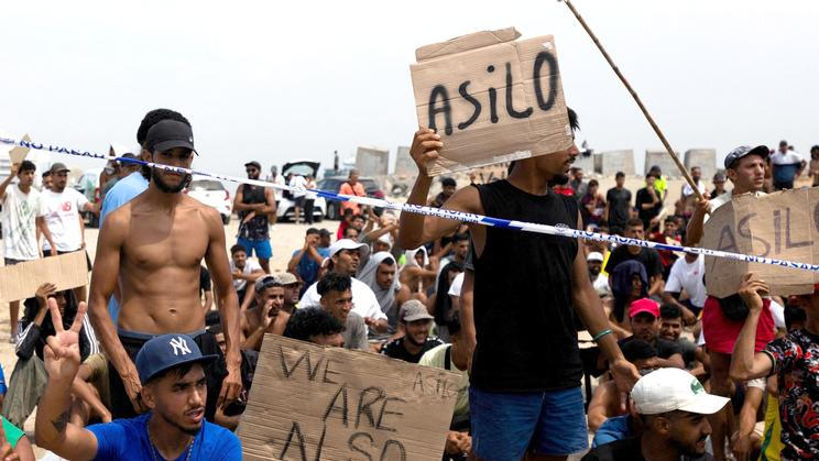 Migrants seek asylum in Ceuta after crossing from Morocco