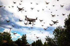 Dozens,Of,Drones,Swarm,In,The,Cloudy,Sky.