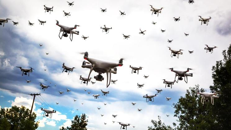 Dozens,Of,Drones,Swarm,In,The,Cloudy,Sky.