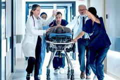 Emergency,Medical,Staff,Moving,An,Injured,Patient,On,A,Stretcher