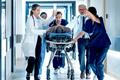 Emergency,Medical,Staff,Moving,An,Injured,Patient,On,A,Stretcher