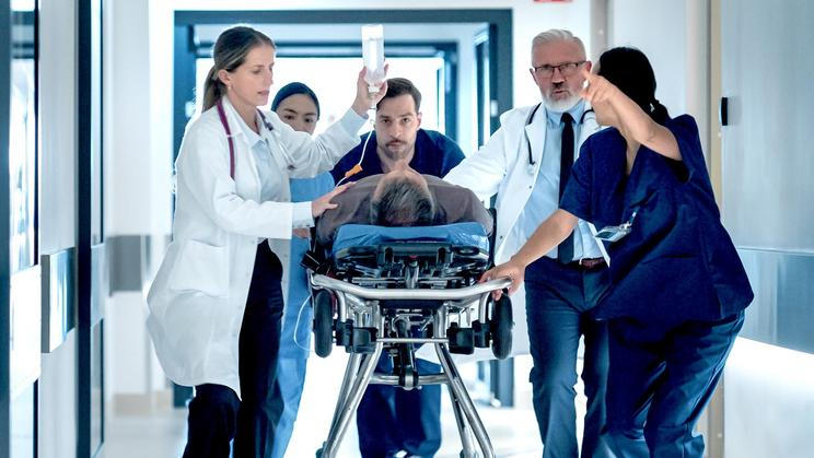 Emergency,Medical,Staff,Moving,An,Injured,Patient,On,A,Stretcher