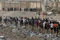 FILE PHOTO: Migrants cross into the Spanish enclave of Ceuta
