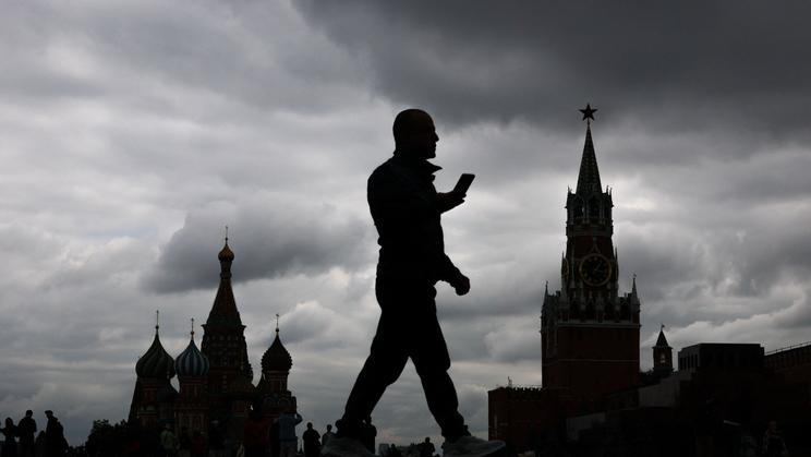 A man walks along Red Square in Moscow