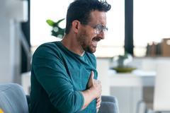 Shot,Of,Mature,Man,Having,A,Heart,Attack,After,Receiving