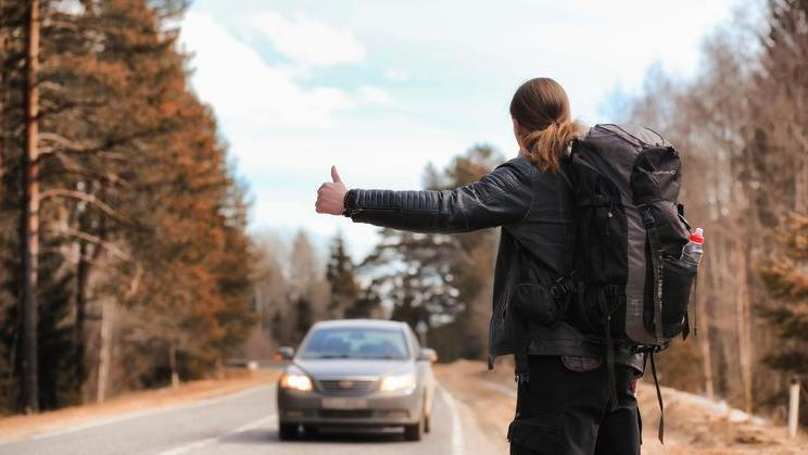 A,Young,Man,Is,Hitchhiking,Around,The,Country.,The,Man