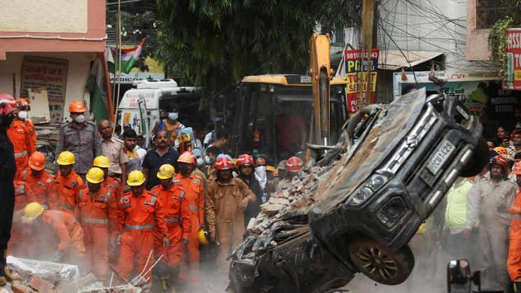 Search for survivors following building collapse in New Delhi
