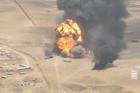 Smoke rises from trucks, near Al-Wadiah
