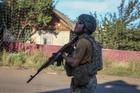 Ukrainian serviceman observes the sky for Russian drones in the frontline town of Druzhkivka