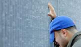 A man greives outside the World Trade Center site in New York