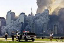 The remaining tower of New York's World Trade Center, Tower 2, dissolves in a cloud of dust and debr..