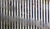 PEOPLE SIT IN WINDOWS AT THE WORLD TRADE CENTER BEFORE COLLAPSE.