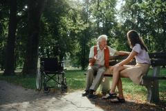 Young,Caregiver,Playing,Chess,With,Lonely,Senior,Client,In,The