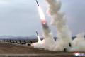 North Korean leader Kim oversees test-launch of multiple rocket launchers