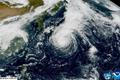 A satellite view shows a typhoon Dujuan approaching Japan