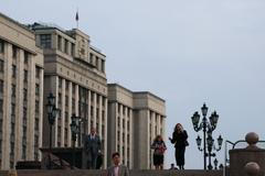 People walk near the State Duma in Moscow