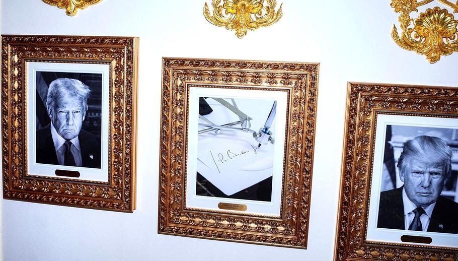 FILE PHOTO: Presidential portraits and framed autopen signing Joe Biden at the White House in Washington