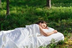 Woman,Sleeps,On,A,Mattress,In,The,Summer,Forest.,The
