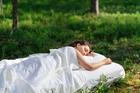 Woman,Sleeps,On,A,Mattress,In,The,Summer,Forest.,The
