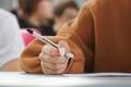 A,Girl,Writes,A,Dictation,Or,Fills,Out,Documents,In
